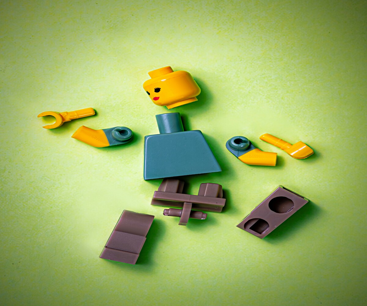 Illustration of a broken toy figure representing burnout causing fatigue, mental exhaustion, and low-energy levels.