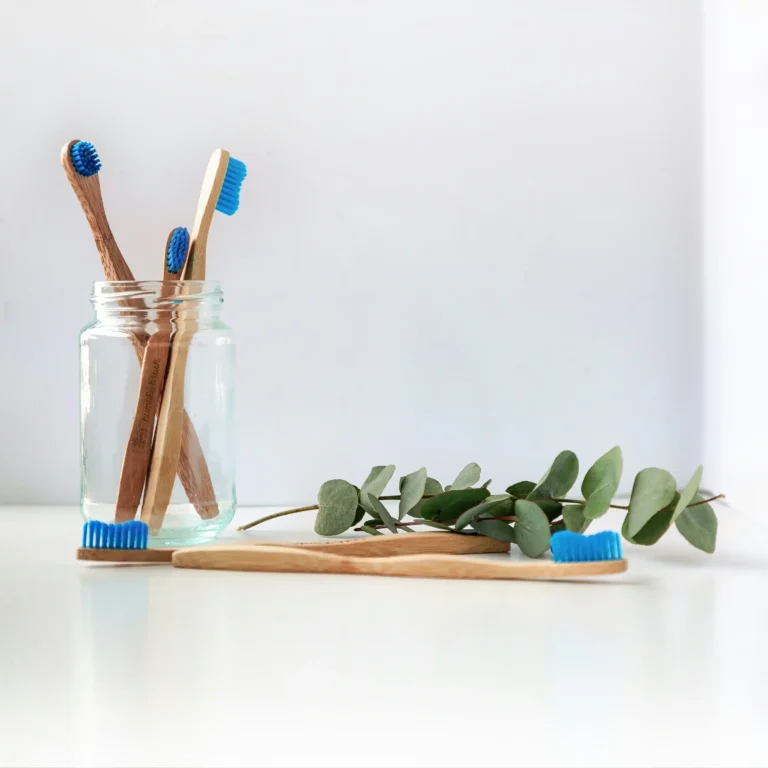 Toothbrushes and oral hygiene items illustrating how stress affects your oral health.