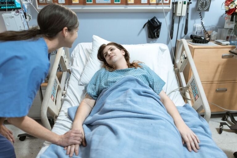 Nurse holding patient's hand, showing the role of empathy in nursing
